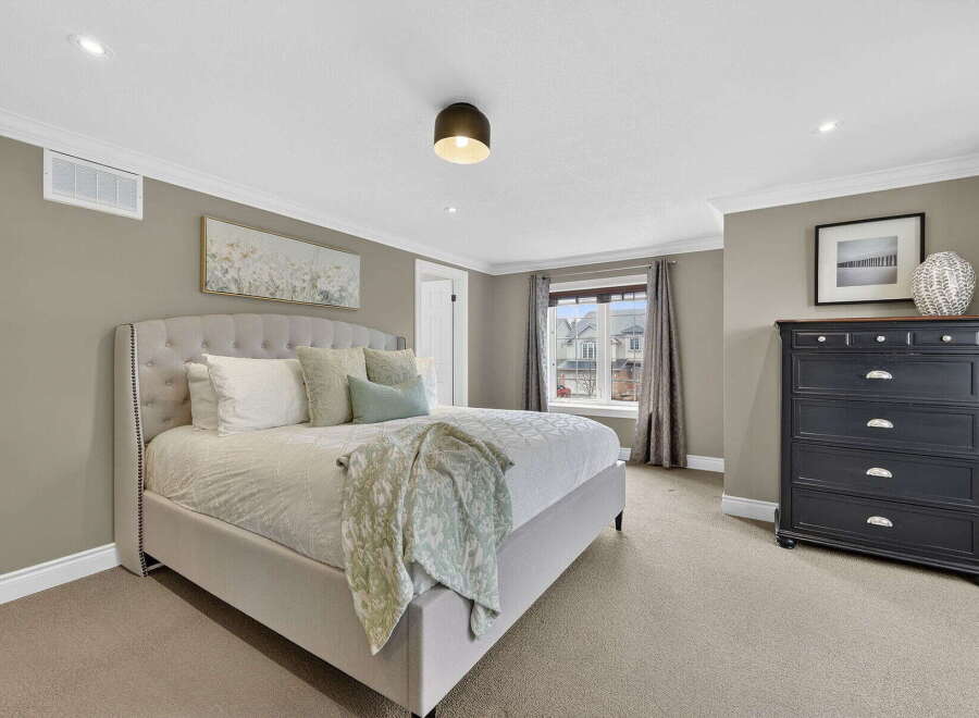 Step into this elegant bedroom, where comfort meets style.