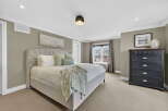 Step into this elegant bedroom, where comfort meets style.