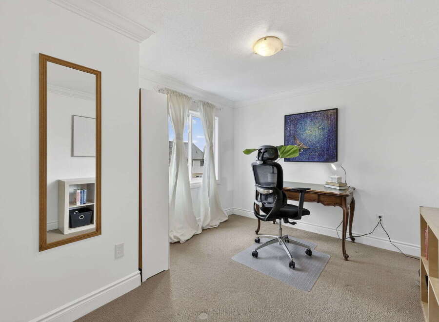 Discover the perfect home office setup in this bright and airy space.