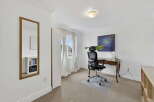 Discover the perfect home office setup in this bright and airy space.
