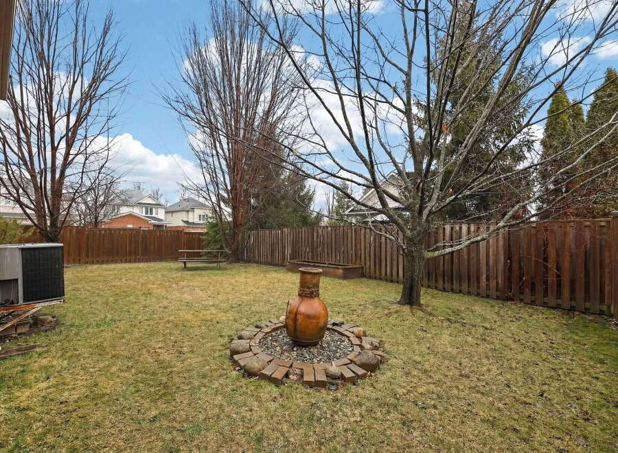 Enjoy the tranquility of this spacious backyard, perfect for relaxation and outdoor gatherings.