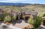 This stunning property boasts a beautiful exterior with a tile roof and a spacious driveway.