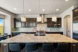 This stunning kitchen boasts a large island with seating, perfect for entertaining.