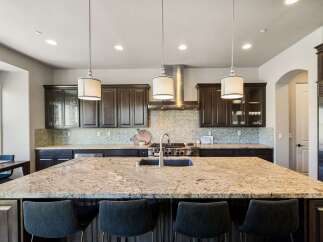 This stunning kitchen boasts a large island with seating, perfect for entertaining.