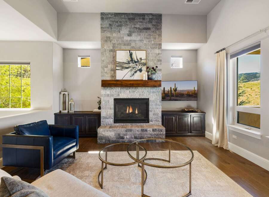 Experience luxury living in this stunning property featuring a modern fireplace, perfect for cozy evenings.