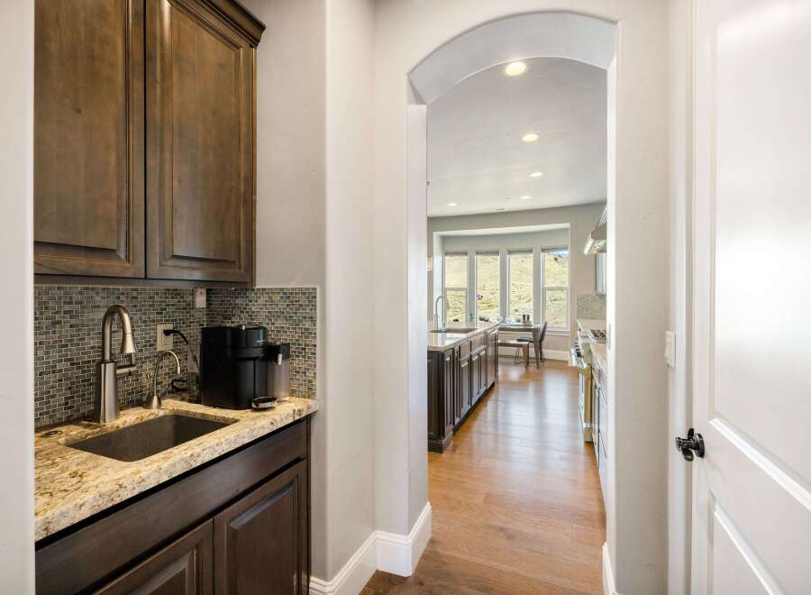 Step into luxury with this stunning kitchen! Featuring a sleek sink, modern appliances, and elegant cabinetry, this space is perfect for both cooking and entertaining.
