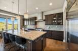 This stunning kitchen boasts a spacious island with a granite countertop, perfect for meal prep and entertaining.