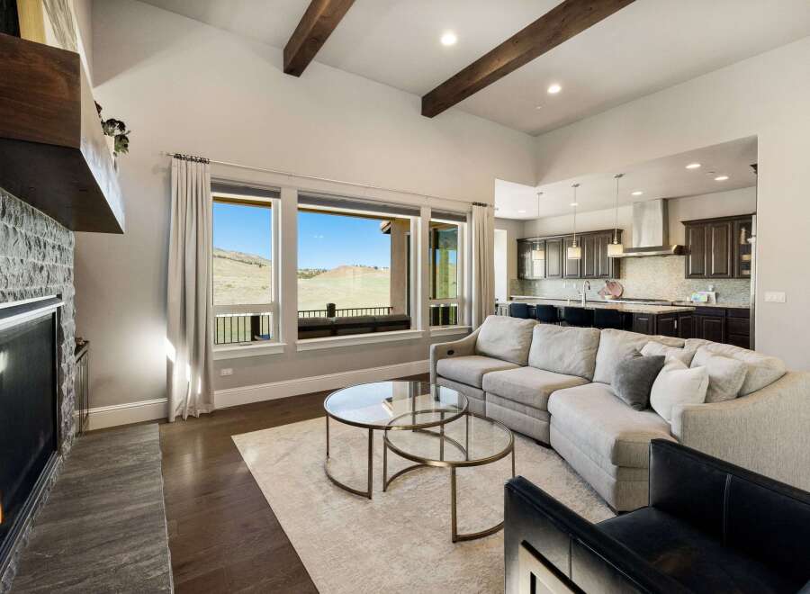 Experience luxury living in this stunning property featuring a cozy fireplace and a spacious living area.