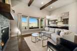 Experience luxury living in this stunning property featuring a cozy fireplace and a spacious living area.
