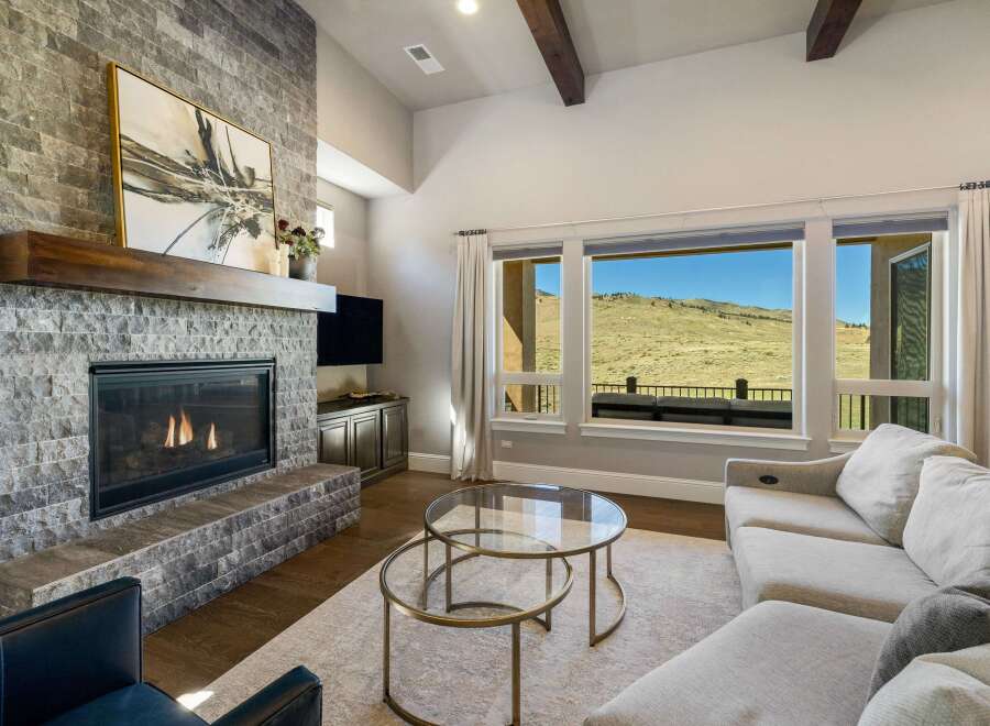 Experience luxury living in this stunning property featuring a cozy fireplace, perfect for chilly evenings.