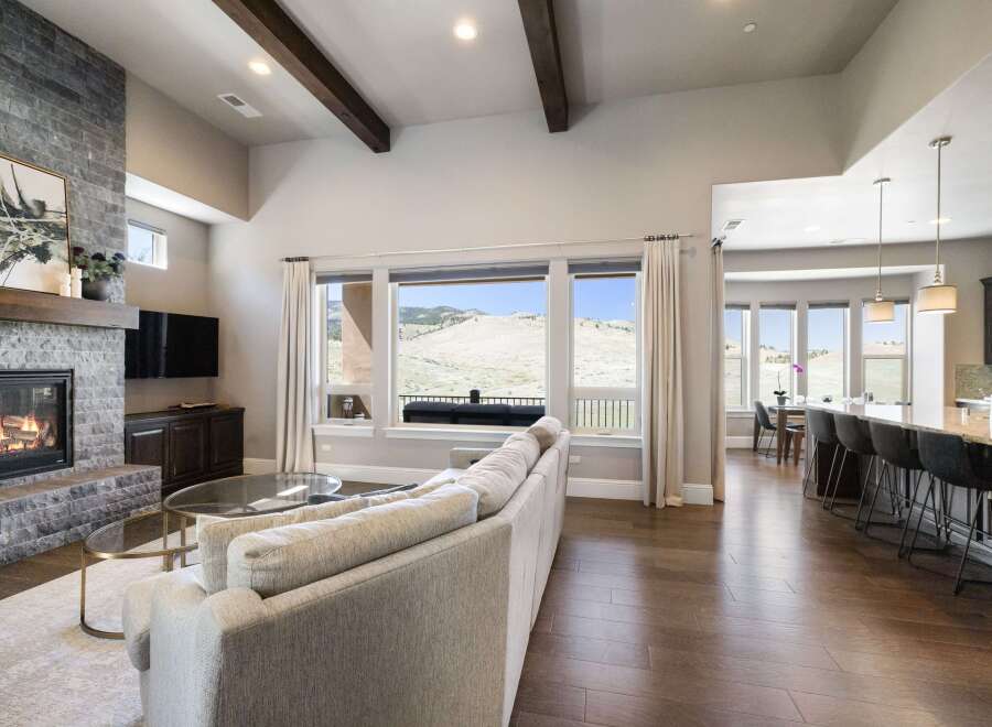 Experience luxury living in this stunning property featuring a cozy fireplace and a spacious living area.