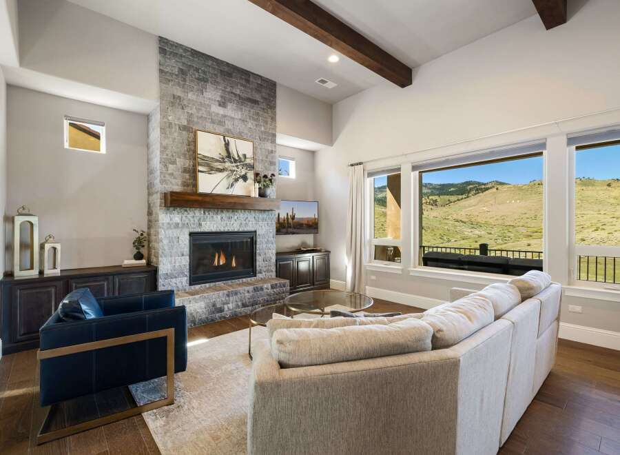 Experience luxury living in this stunning property featuring a cozy fireplace and a spacious living area.
