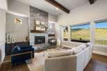 Experience luxury living in this stunning property featuring a cozy fireplace and a spacious living area.