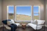 Enjoy breathtaking views from this stunning property! This home features a bright and airy living space with large windows that frame the picturesque landscape.