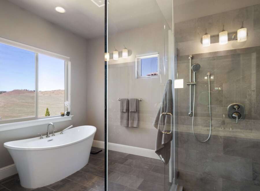 This luxurious bathroom features a modern freestanding tub, perfect for relaxing after a long day.