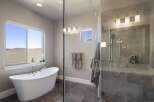 This luxurious bathroom features a modern freestanding tub, perfect for relaxing after a long day.