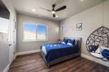 This stunning bedroom boasts a modern design with a touch of whimsy, perfect for a child or space enthusiast.