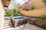 Enjoy luxurious relaxation in this stunning outdoor hot tub oasis.