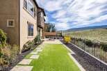 Enjoy the beauty of this stunning property featuring a meticulously landscaped backyard.
