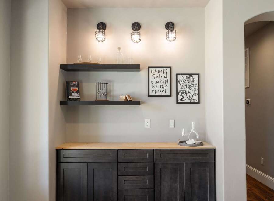 This stunning home features a stylish bar area, perfect for entertaining guests.