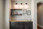 This stunning home features a stylish bar area, perfect for entertaining guests.