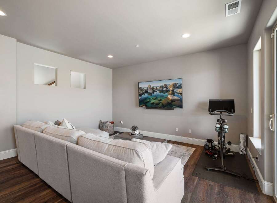 This stunning property boasts a modern living space, perfect for relaxation and entertainment.