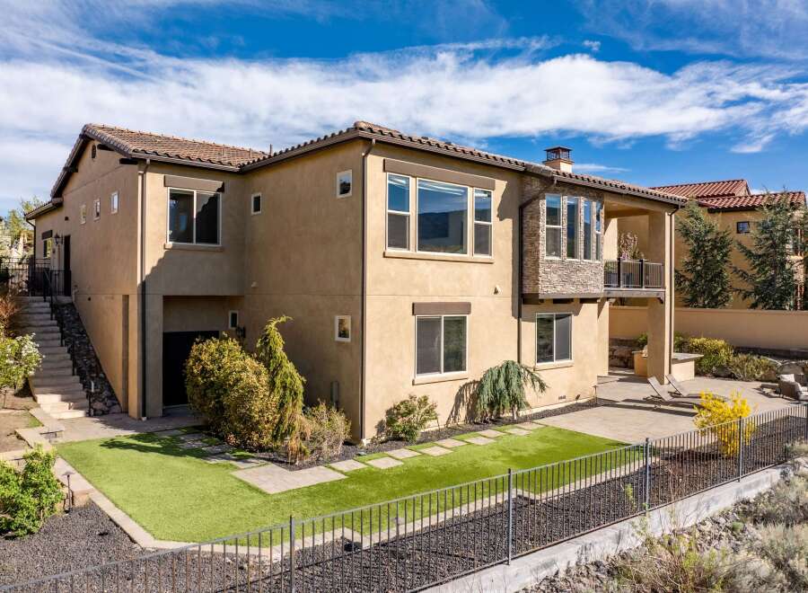 This stunning property boasts a modern design with a beautiful exterior.