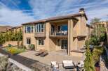 This stunning property boasts a beautiful exterior with a spacious patio and a second-floor balcony, perfect for outdoor relaxation and entertaining.