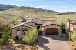 This stunning property boasts a beautiful exterior with a well-maintained driveway and lush landscaping.