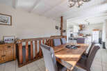 This charming property boasts a rustic dining area, perfect for family gatherings.