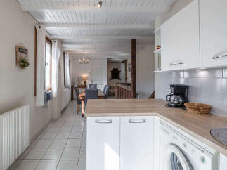 This charming property boasts a bright and airy kitchen with modern appliances and ample counter space.