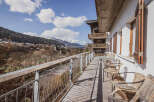 Enjoy breathtaking mountain views from this charming balcony.