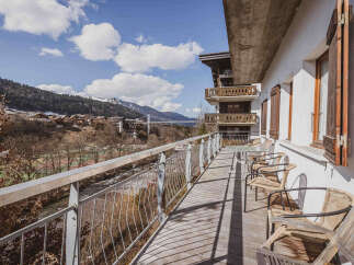 Enjoy breathtaking mountain views from this charming balcony.