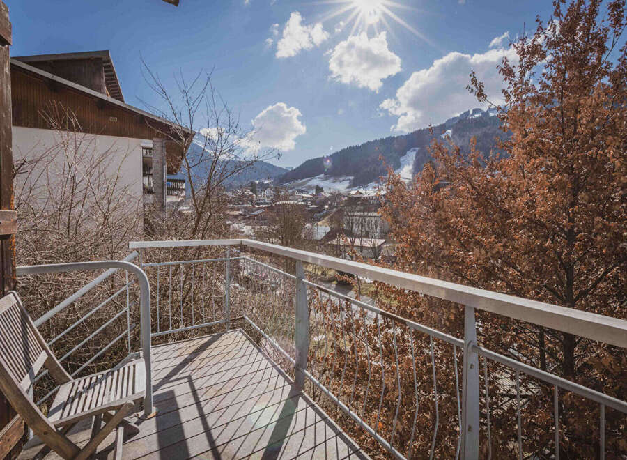 Enjoy breathtaking mountain views from this charming balcony.