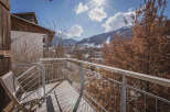 Enjoy breathtaking mountain views from this charming balcony.