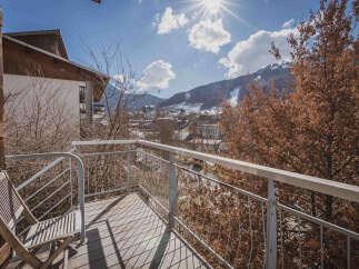 Enjoy breathtaking mountain views from this charming balcony.