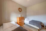 This cozy bedroom features two twin beds, perfect for guests or a shared living space.