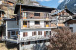 Discover a stunning property nestled in a picturesque mountain setting.