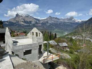 Discover a stunning property under construction, offering breathtaking mountain views.