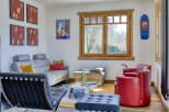 This stylish living room features a comfortable gray sofa, perfect for relaxing.