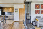 This stunning property boasts a modern kitchen with rustic wooden cabinetry, perfect for culinary enthusiasts.