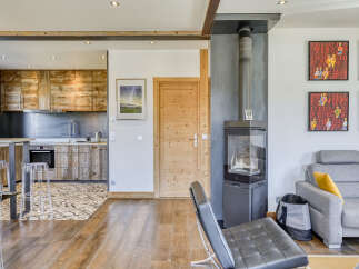 This stunning property boasts a modern kitchen with rustic wooden cabinetry, perfect for culinary enthusiasts.