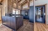 This stunning kitchen showcases a modern design with a touch of rustic charm.