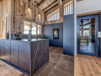 This stunning kitchen showcases a modern design with a touch of rustic charm.