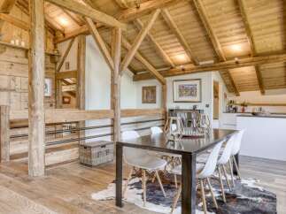 Experience rustic elegance in this stunning property, featuring exposed wooden beams and a warm, inviting atmosphere.