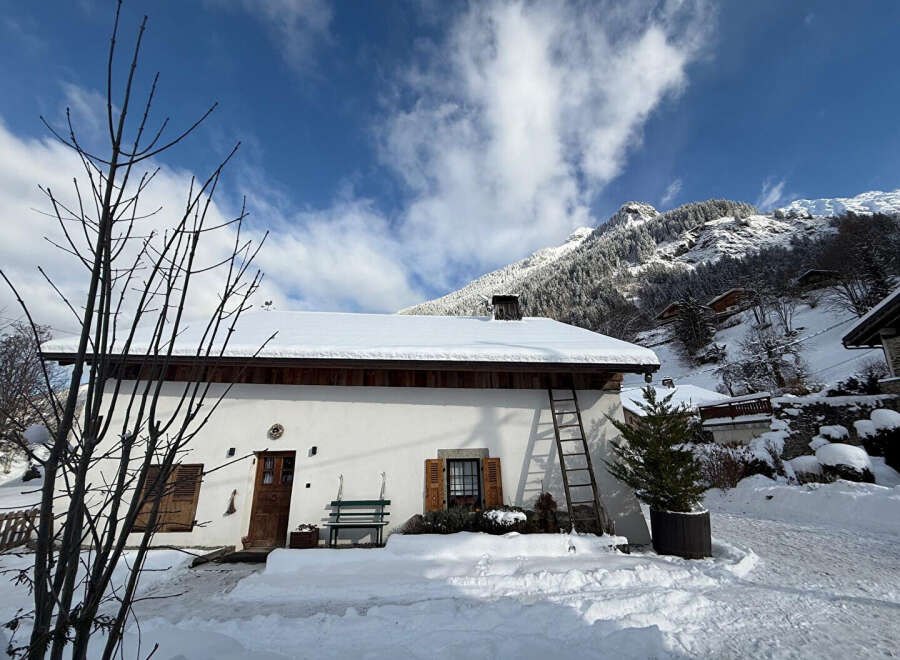 Nestled in a picturesque winter wonderland, this charming property offers a cozy retreat.