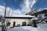 Nestled in a picturesque winter wonderland, this charming property offers a cozy retreat.