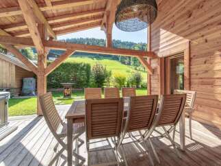 Enjoy the tranquility of this stunning outdoor dining area, perfect for entertaining or relaxing.