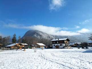 Discover a charming property nestled in a picturesque winter wonderland.