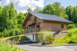 Discover the charm of this stunning wooden chalet nestled in a serene natural setting.